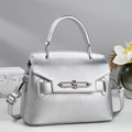Silver lychee grain leather mini pillow bag with metal chain lock and crossbody strap - Silver