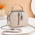 Beige quilted PU leather square crossbody bag with bear pendant and chain strap - Off-white