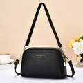 Black litchi pattern leather crossbody bag with triple gold zippers and shoulder strap - Black