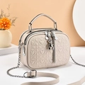 Elegant cream heart quilted crossbody bag with three zipper compartments and bear charm - Off-white