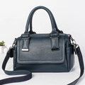 Dark blue leather texture Boston bag with dual handles and woven shoulder strap - Blue