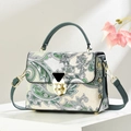Retro paisley print crossbody handbag with green leather handles and gold rotating lock - Green