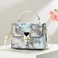 Detail of bohemian paisley handbag with white handles and golden triangle buckle - Off-white