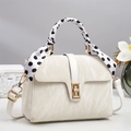Detail of cream white marble texture handbag with gold lock and polka dot scarf handle - Off-white