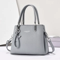 Gray lychee grain leather handbag with top handles and star pendant on a minimalist base - Blue