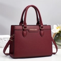Elegant wine red leather handbag with gold hardware and stylish flower decor - 28/11/21 / Red
