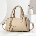 Beige litchi grain leather crossbody handbag with star charm and top handles - Light Khaki