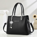 Elegant black lychee leather women's handbag with silver Fashion & Bag logo - Black