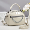 Minimalist beige lychee grain crossbody bag with double zippers and silver chain detail - Off White