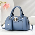 Blue large capacity Boston handbag with crossbody strap and small charm on stone pedestal - Blue