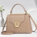 Taupe pebbled leather handbag with gold oval clasp and adjustable crossbody strap - Khaki