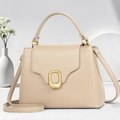 Elegant beige lychee leather square handbag with golden oval lock and crossbody strap - Apricot