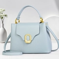 Elegant light blue leather small square handbag with golden oval lock and handle - Blue