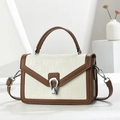 Chic cream and brown crocodile texture handbag with metal buckle on white stand - Brown & White