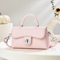 Pale pink minimalist crossbody bag with silver ring clasp on a stone tray setup - Pink