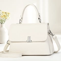 Elegante borsa in pelle bianco crema con chiusura argentata e sfondo floreale - Bianco Sporco