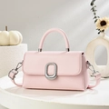 Detail of light pink square crossbody bag with silver metal ring and smooth leather texture - Pink