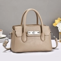 Detail of beige pebble leather handbag with silver metal twist lock and round handles - Khaki