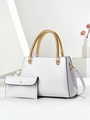 Detail of white crocodile embossed tote bag with unique golden woven metal handles - White
