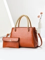 Close-up of brown crocodile texture tote bag with golden woven handles and matching pouch - Khaki/Earth Yellow