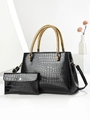 Detail of black crocodile texture handbag with golden braided handles and clutch bag - Black