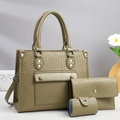 Detailed view of olive green woven tote bag set with matching wallet and card holder accessory - Green