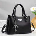 Elegant black lychee textured leather handbag with silver hardware and shoulder strap - Black