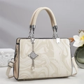 Detail of marble pattern PU leather handbag with silver chain and pearl pendant charm - Off White