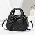 Schwarze Handtasche mit Schlangenmuster, großer Schleife und abnehmbarem Schultergurt - Schwarz