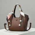 Brown lychee leather handbag detail with decorative silk scarf and silver hardware - Coffee