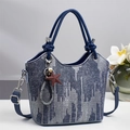 Blue denim tote bag with white wavy patterns and a brown star charm accessory - Dark Blue