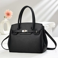 Classic black lychee pattern leather handbag with gold metal lock and cross-body strap - Black
