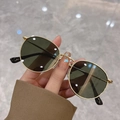 Classic small round gold metal sunglasses with dark lenses for a retro fashion look - Gold Frame Green Lens