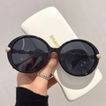 Lunettes de soleil rondes noires oversize avec détails feuilles dorées et étui - Monture Noire Verres Gris