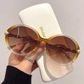 Lunettes de soleil rondes ambre avec verres dégradés marron et détails feuilles dorées - Monture Dégradé Jaune Verres Thé