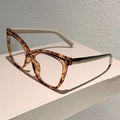 Side view of cat-eye eyewear frames with tortoiseshell front and contrast cream temples - Tortoise Frame Transparent Lens Coffee Black Stripes