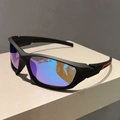 Black matte sports sunglasses with purple iridescent lenses on a geometric stand - Black Frame Blue Mirrored Lens