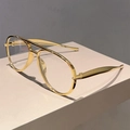 Lunettes aviateur classiques à monture métallique dorée sur support géométrique - Monture Dorée Verres Transparents