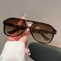 Close-up of tortoise shell aviator sunglasses with brown gradient lenses and metal hinge - Leopard Frame Gradient Tea Lens