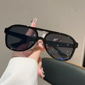 Close-up of classic black aviator sunglasses with double bridge and glossy frame - Black Frame Black Grey Lens