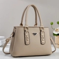 Minimalist beige pebble leather tote bag with gold chain and top handles on a clean background - Apricot