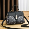 Black minimalist satchel with geometric print and gold twist lock for daily commute - Retro Monogram Black (Black 1)
