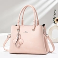 Pink faux leather tote bag with pleated detail, top handles, and clover charm attachment - Pink