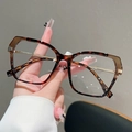 Occhiali da vista cat-eye tartarugati da donna con eleganti dettagli in metallo dorato - Tè Trasparente Leopardo Montatura Lente Trasparente