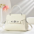 Minimalist beige pebble leather bucket bag with silver buckle and crossbody strap - Off-white