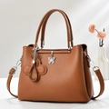 Brown lychee grain leather tote bag with silver butterfly charm and adjustable strap - Khaki/Earth Yellow