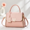 Elegant pink textured leather tote bag with gold T-shaped clasp and floral decor - Pink