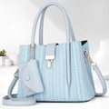 Detail of light blue crossbody bag featuring woven texture and a mini matching pouch - Blue