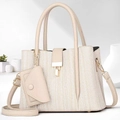 Detail of cream white tote bag with textured fabric, gold clasp and small coin purse charm - Apricot
