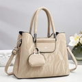 Elegant apricot embossed crossbody handbag for women with mini coin purse charm - Apricot